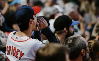 man-calling-out-at-sporting-event