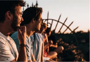 men-looking-towards-sunset
