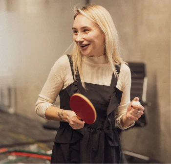 woman-with-ping-pong-paddle-and-ball