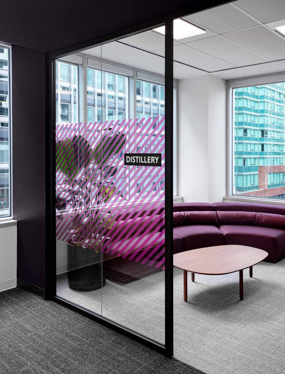 Toronto Digital Technology Company private meeting room with purple lounge seating biophilia