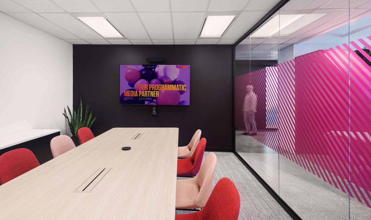 Boardroom with pink and red Studio TK Beso Chairs